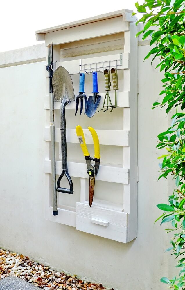 White tool rack made of wooden pallets