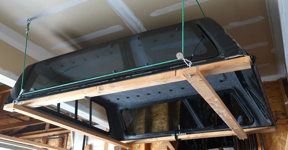 Wooden frames hanging on a pulley from the ceiling