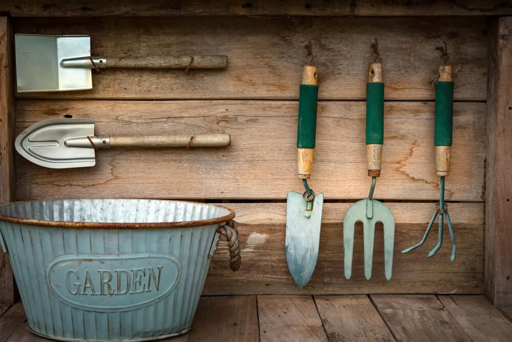 Small gardening tools haning on the wall
