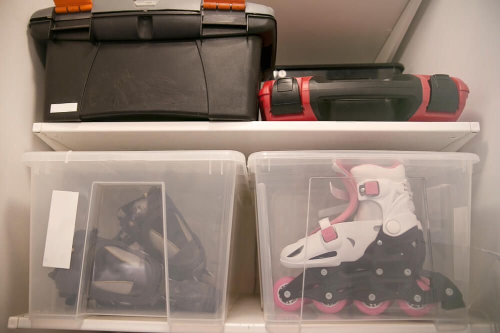 Skates and sporting eqipment stored in clear boxes