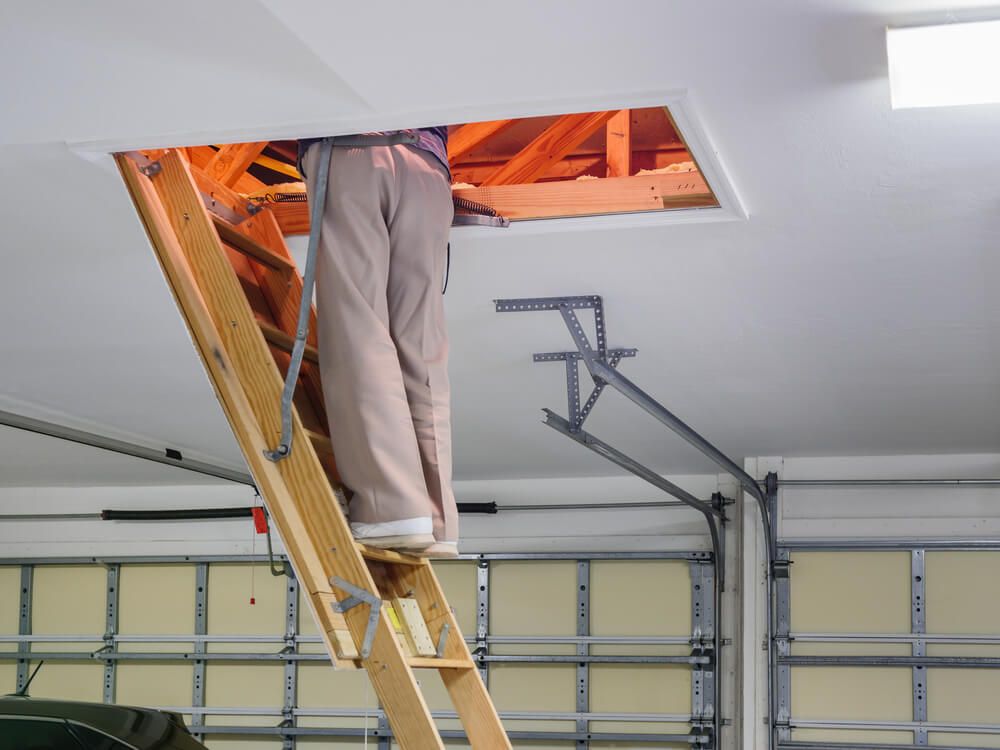 Man inspecting garage attic