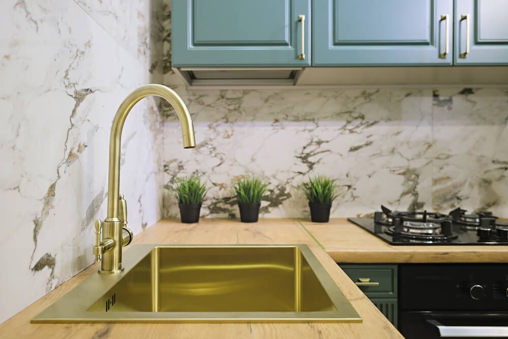 Contemporary brass kitchen sink in gold color