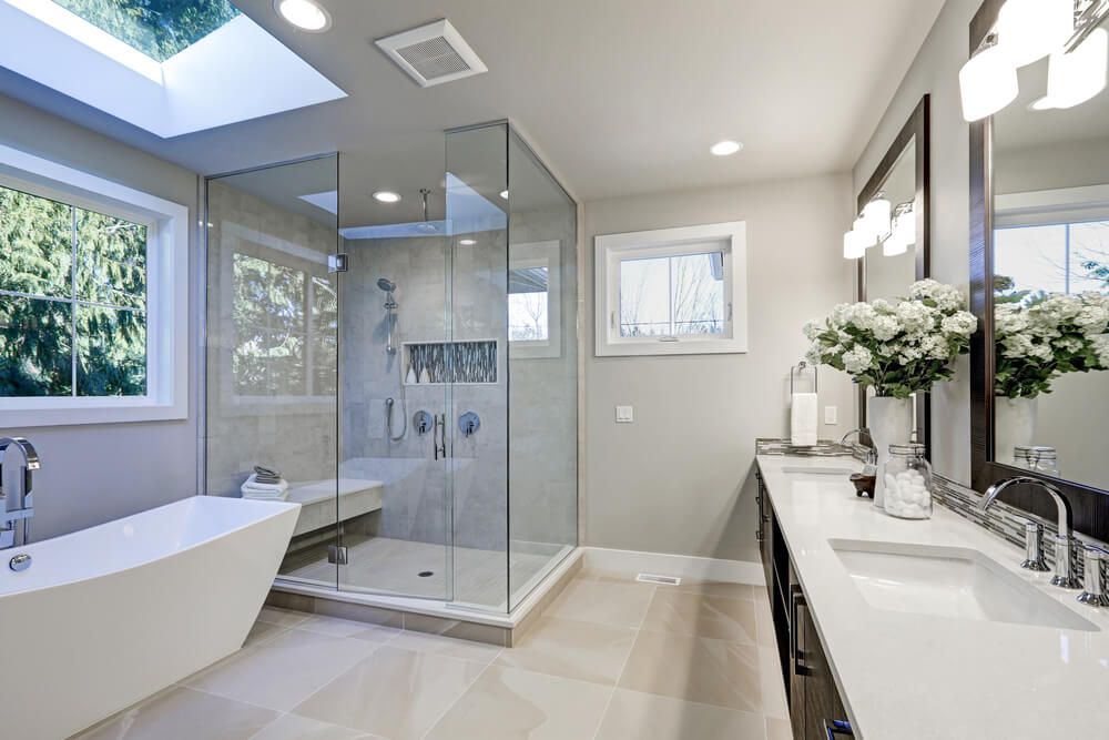 Spacious modern bathroom with glass shower