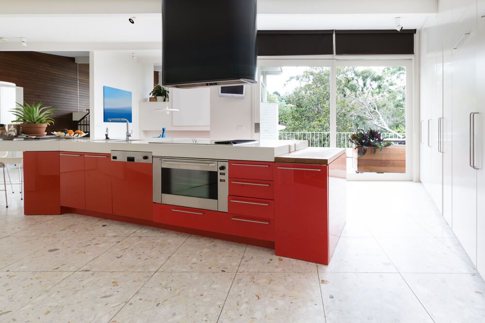 red kitchen cabinets in island bench in modern luxury Australian home