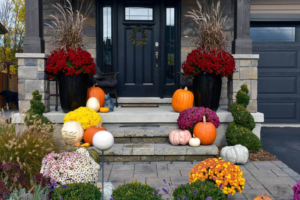 front porch decorated with pumpkins