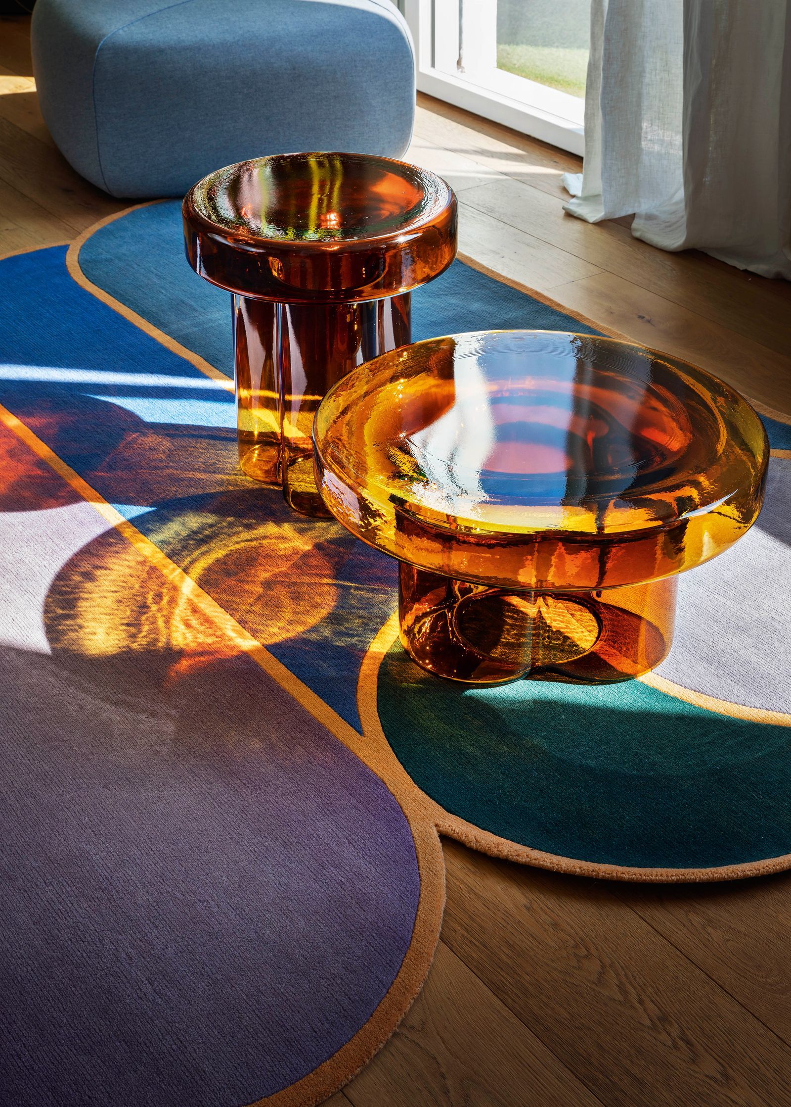 round orange glass tables 