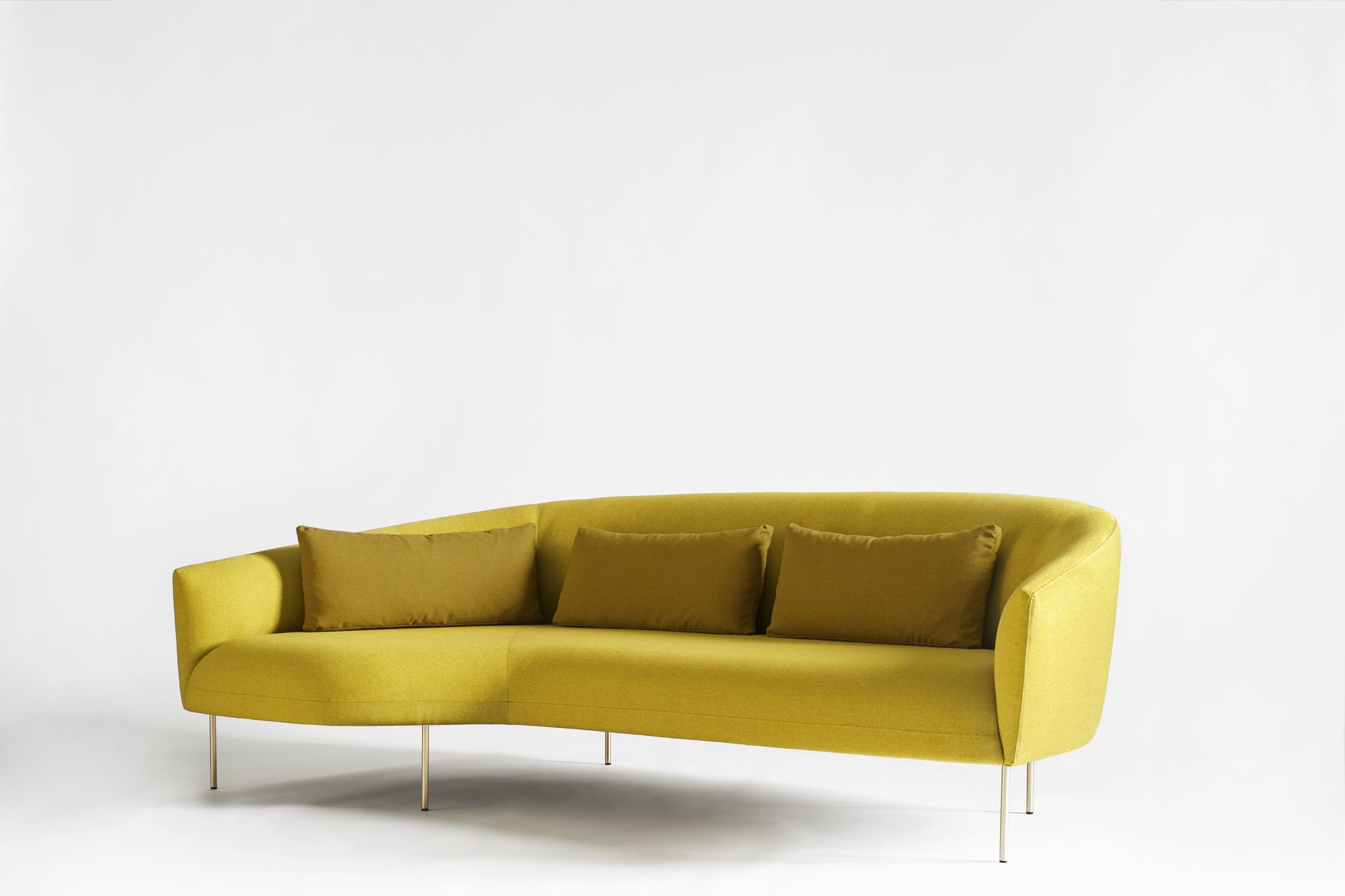 mustard yellow couch with pillows