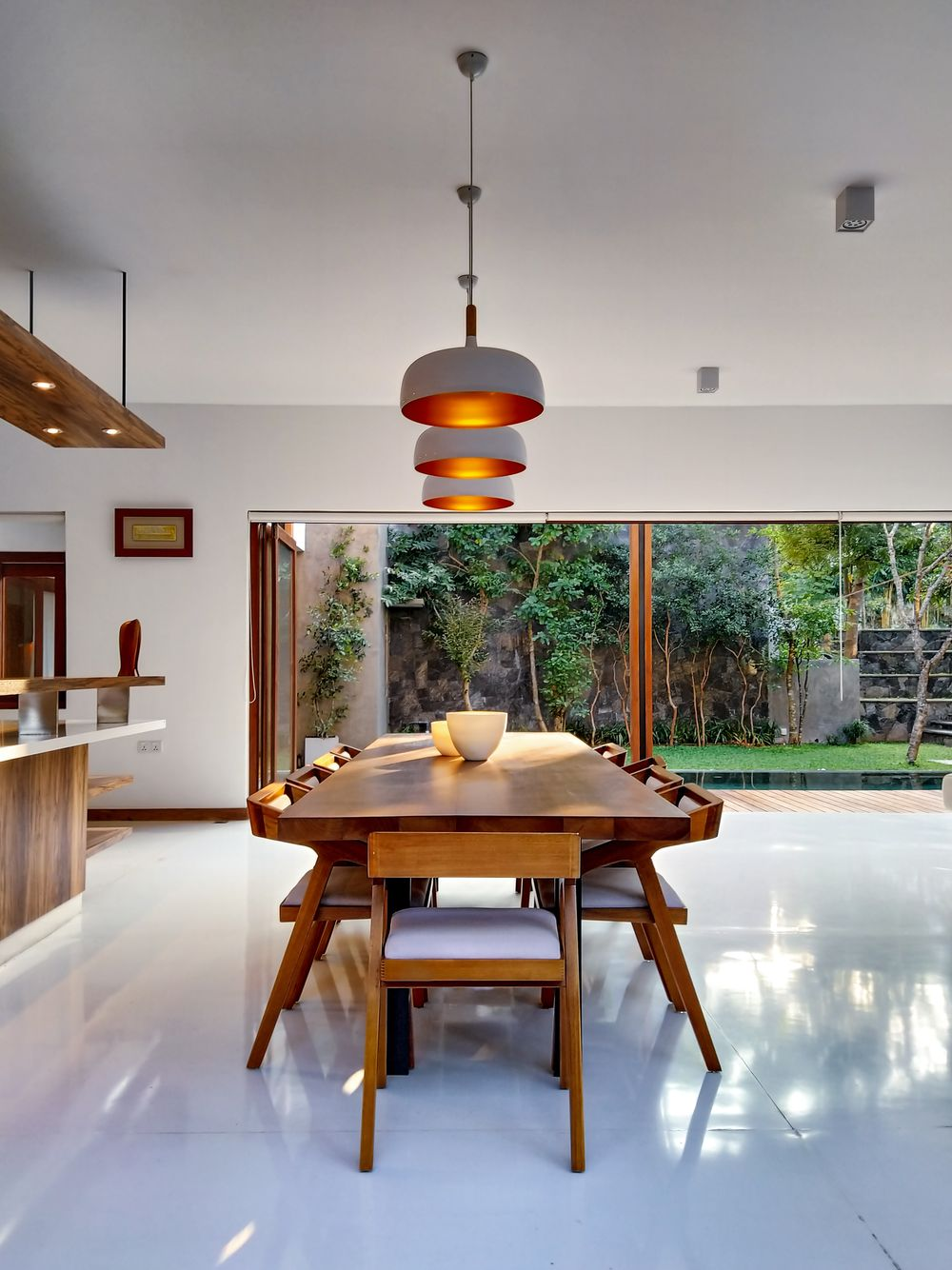 dining area with wide floor to ceiling windows