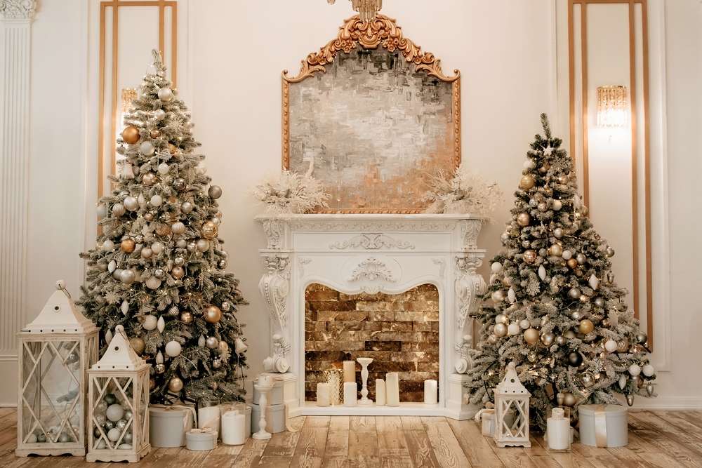 Two decorated Christmas trees on the sides of the hall and a fireplace in the center.