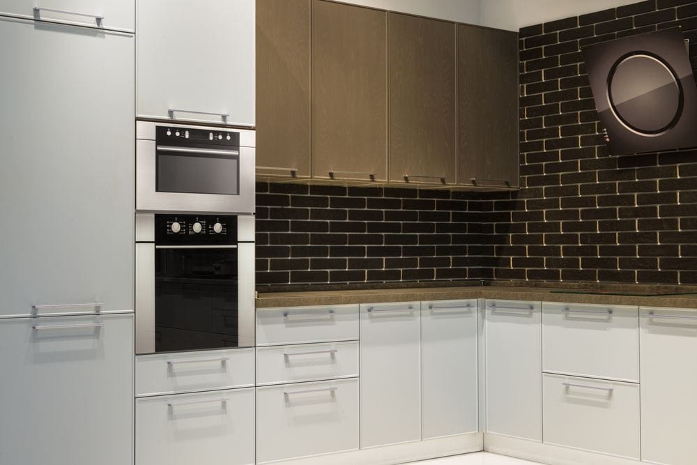 Modern kitchen with black backsplash and white grout