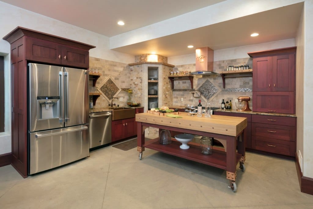 kitchen with dark cherry cabinets and brick tiles