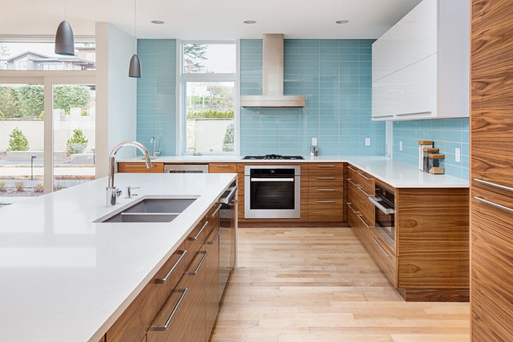 luxury kitchen with blue counter to ceiling tiles