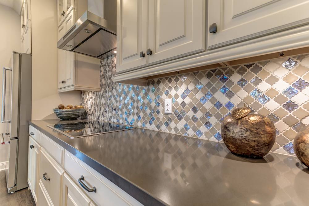 mixed tiles kitchen backsplash