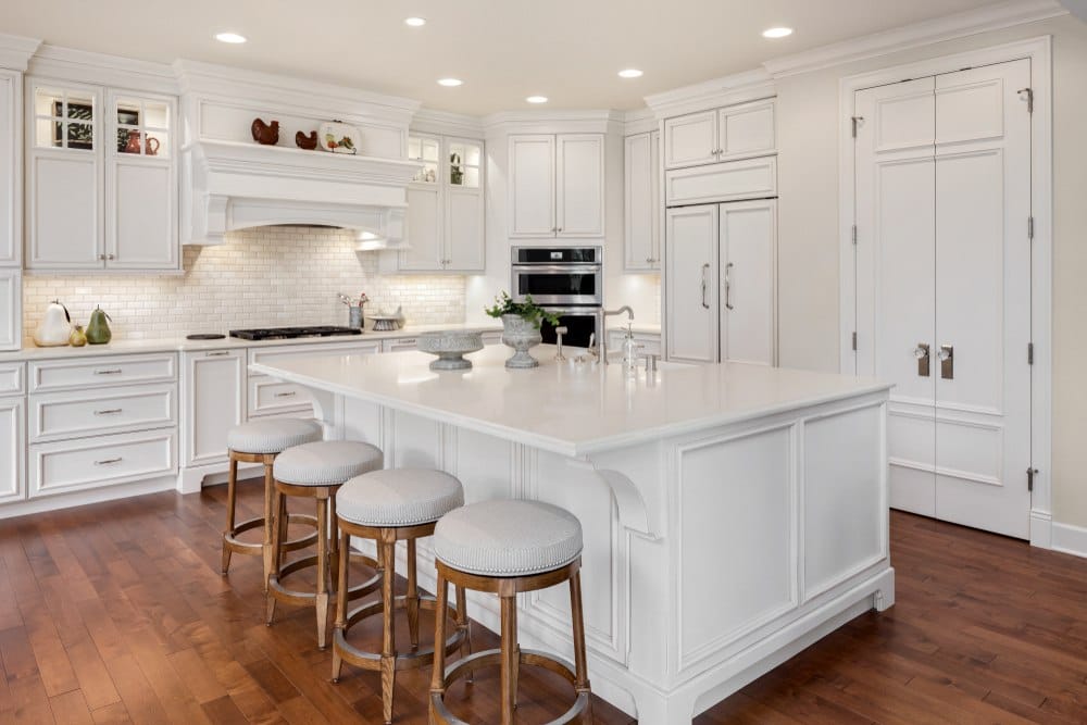 all white kitchen with wooden floors