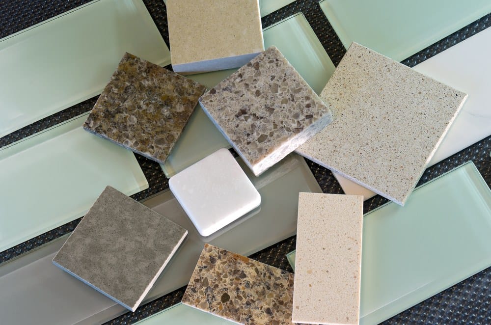 Glass subway tile samples used in kitchen backsplashes and quartz samples