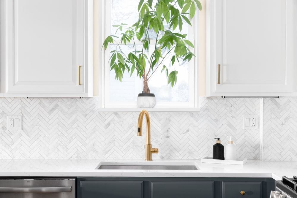 Luxury kitchen with herringbone backsplash tiles