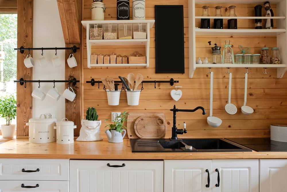 kitchen in rustic style with vintage kitchen ware and wooden wall