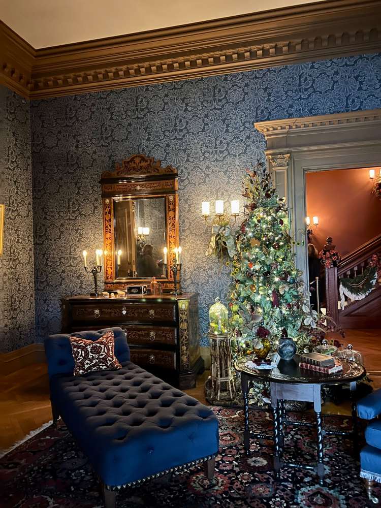 christmas tree in a historic home with blue decor