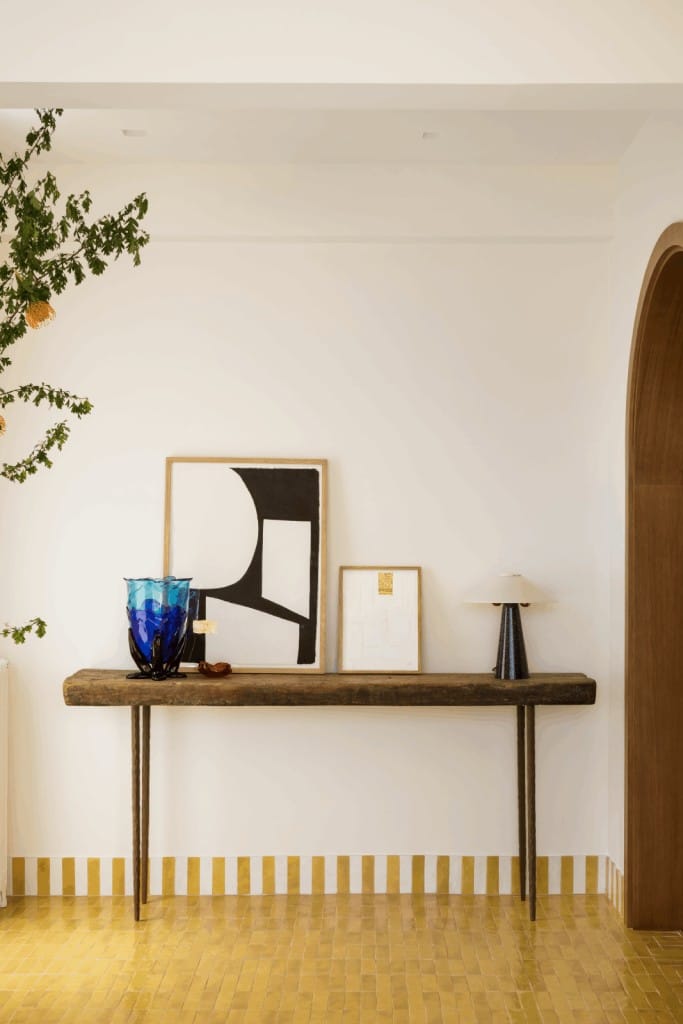 wooden entrance table with light background and tiled floors