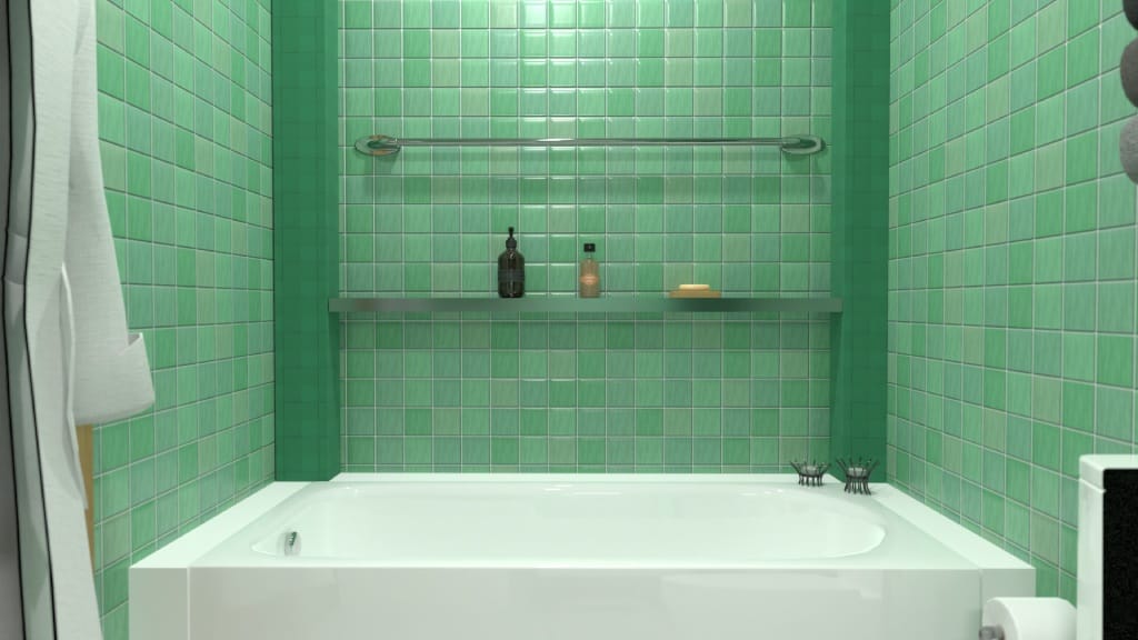 белая ванна на фоне зеленой плитки