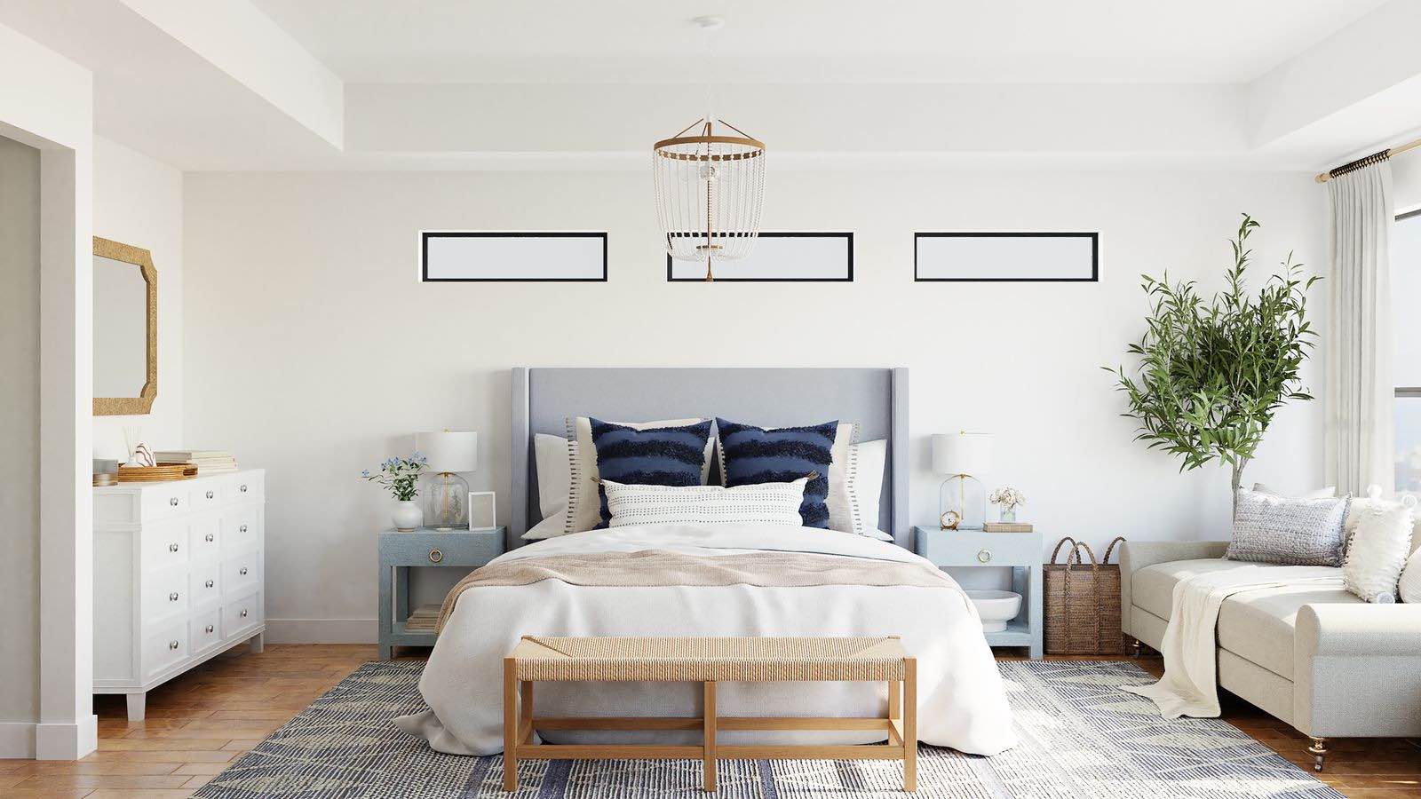 dormitorio grande y luminoso con cabecero azul y muebles blancos de tendencia