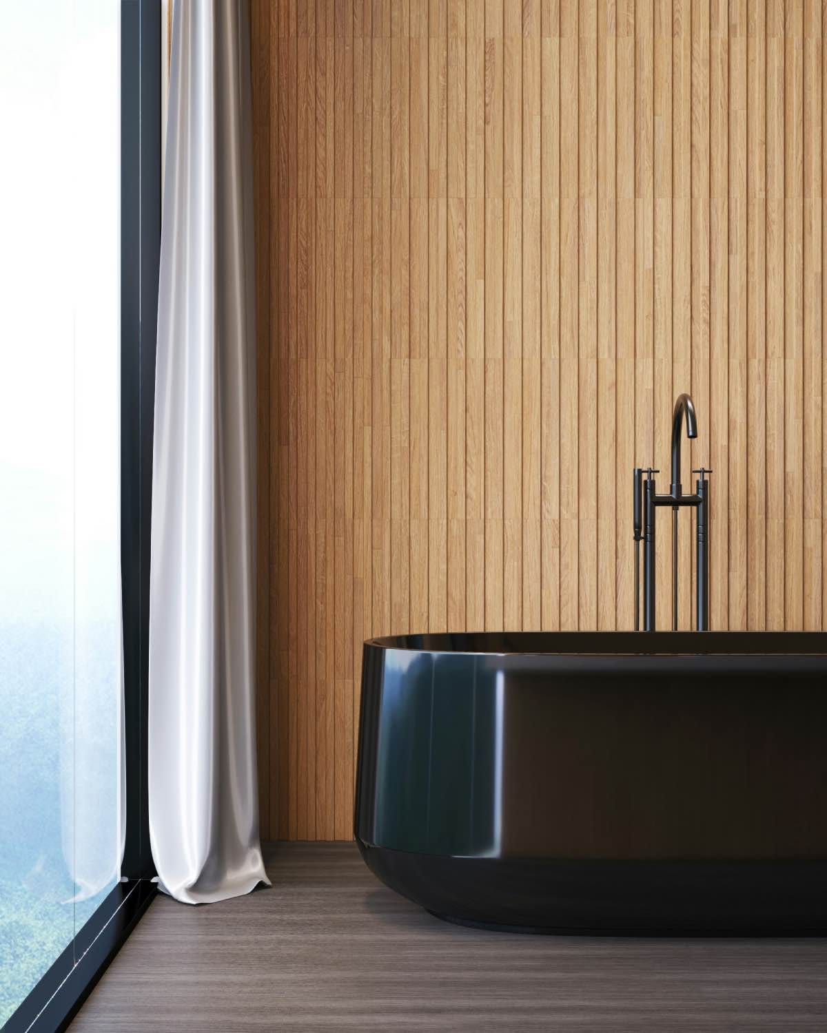 cuarto de baño moderno con bañera negra y grifo negro, pared madera