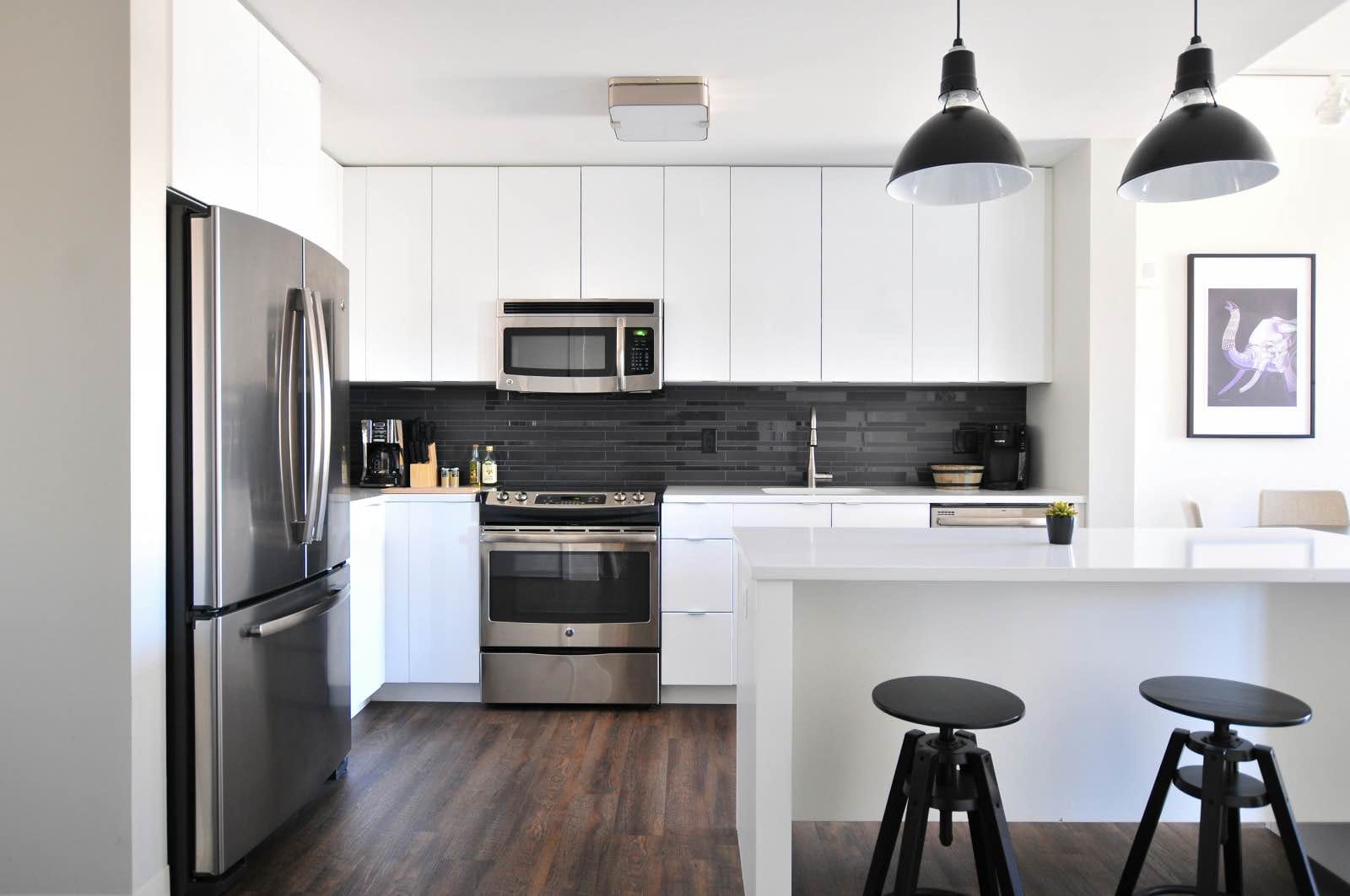 White kitchen with black backsplash