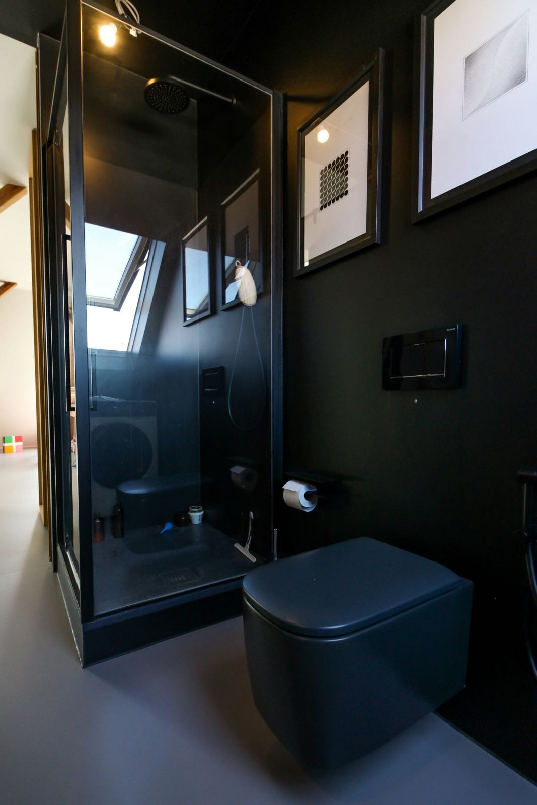 renovated modern black bathroom, black toilet and black shower