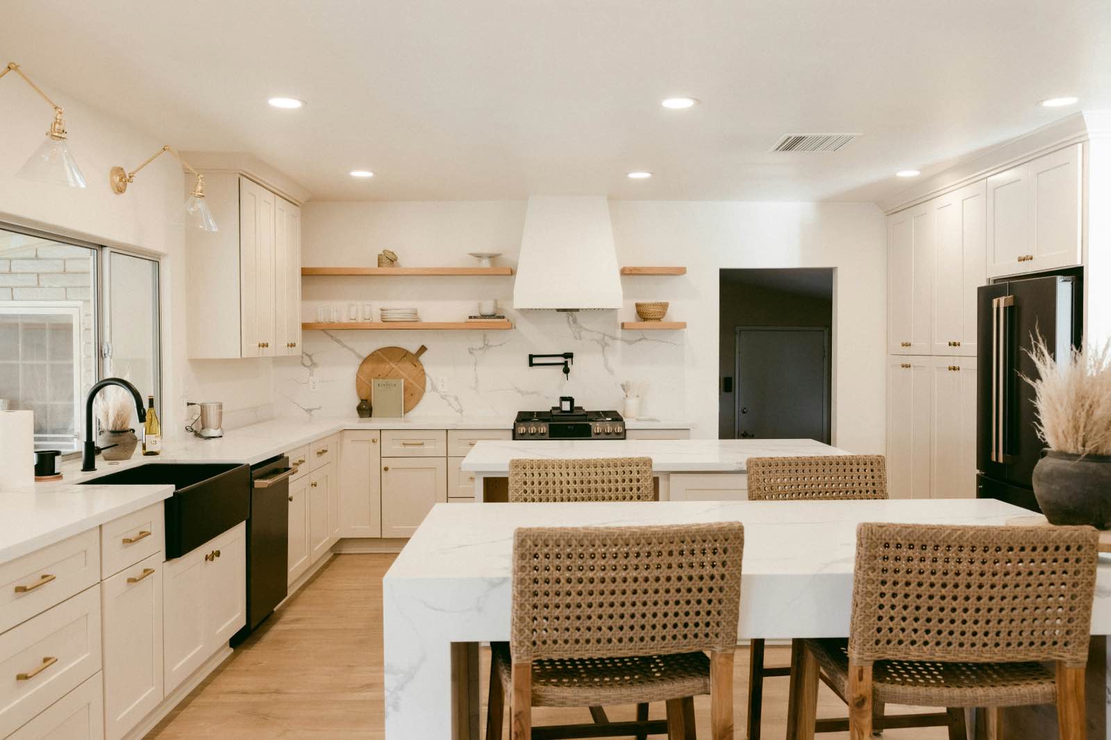 modern white kitchen with marble kitchen islands