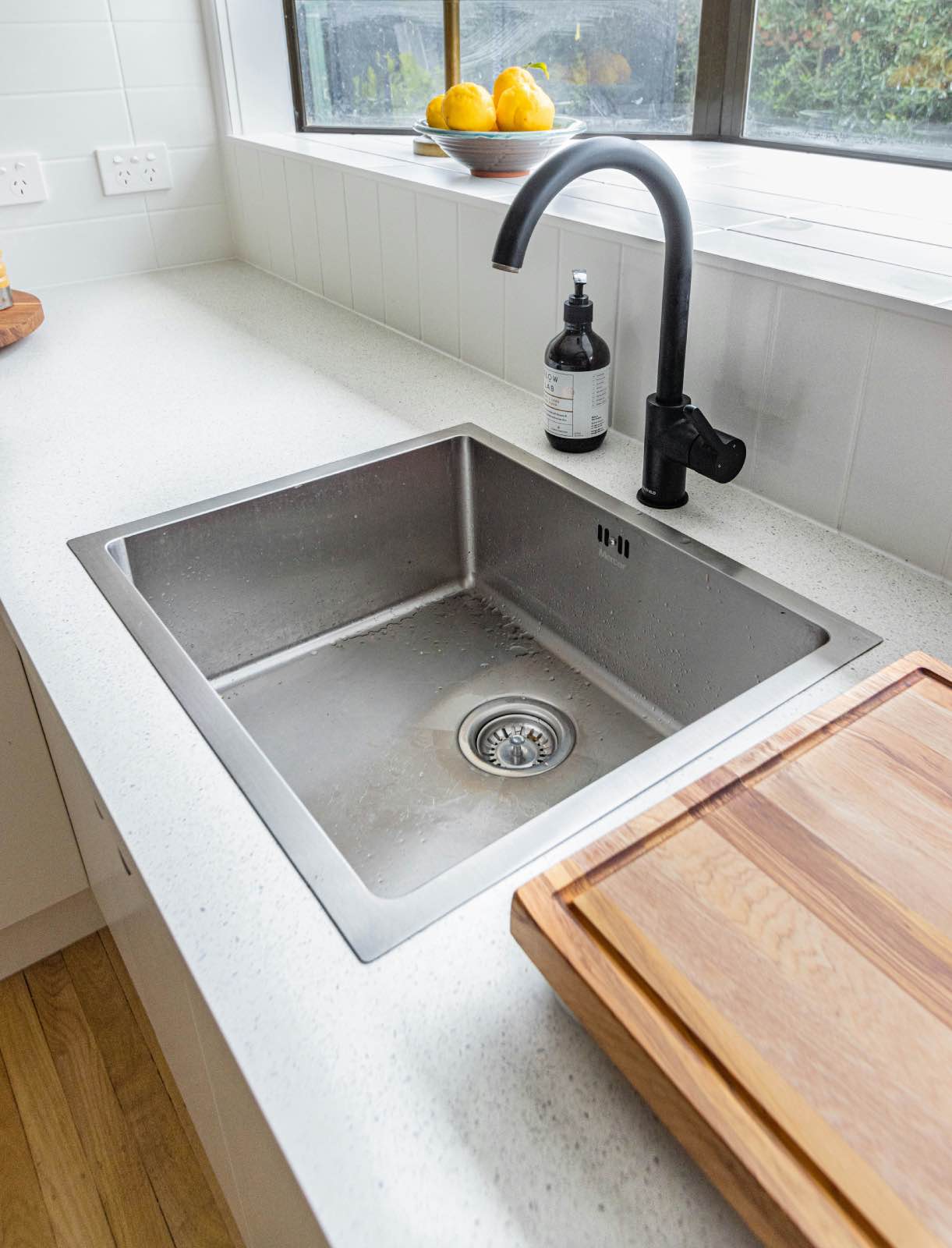 kitchen sink with modern matte black faucet