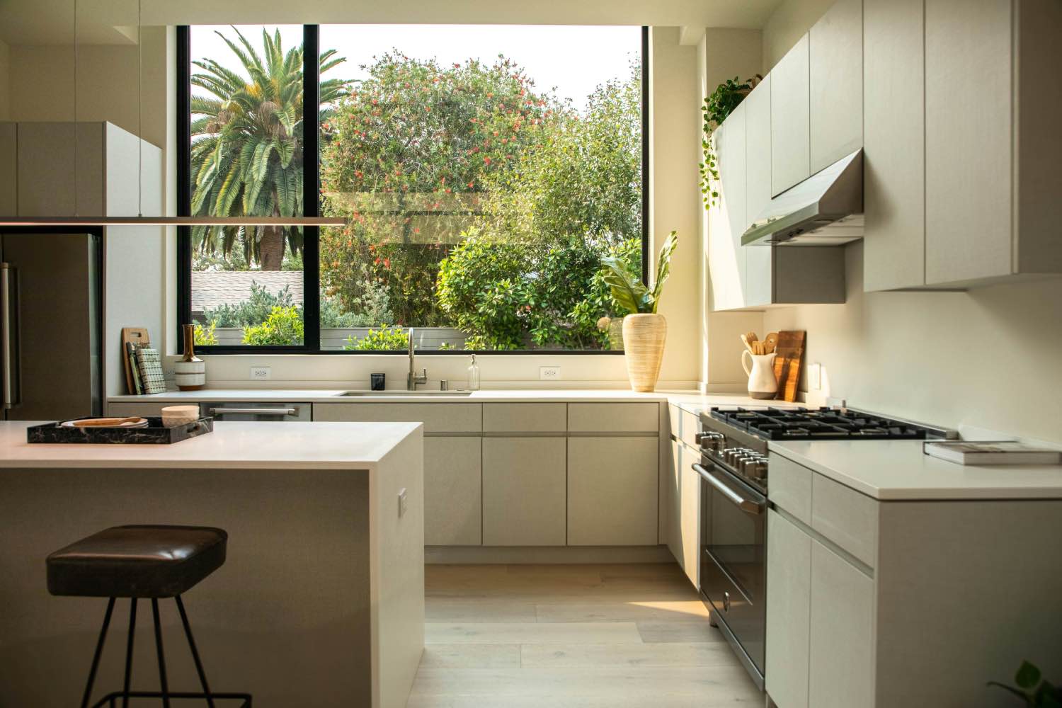 modern renovated kitchen in white with big window