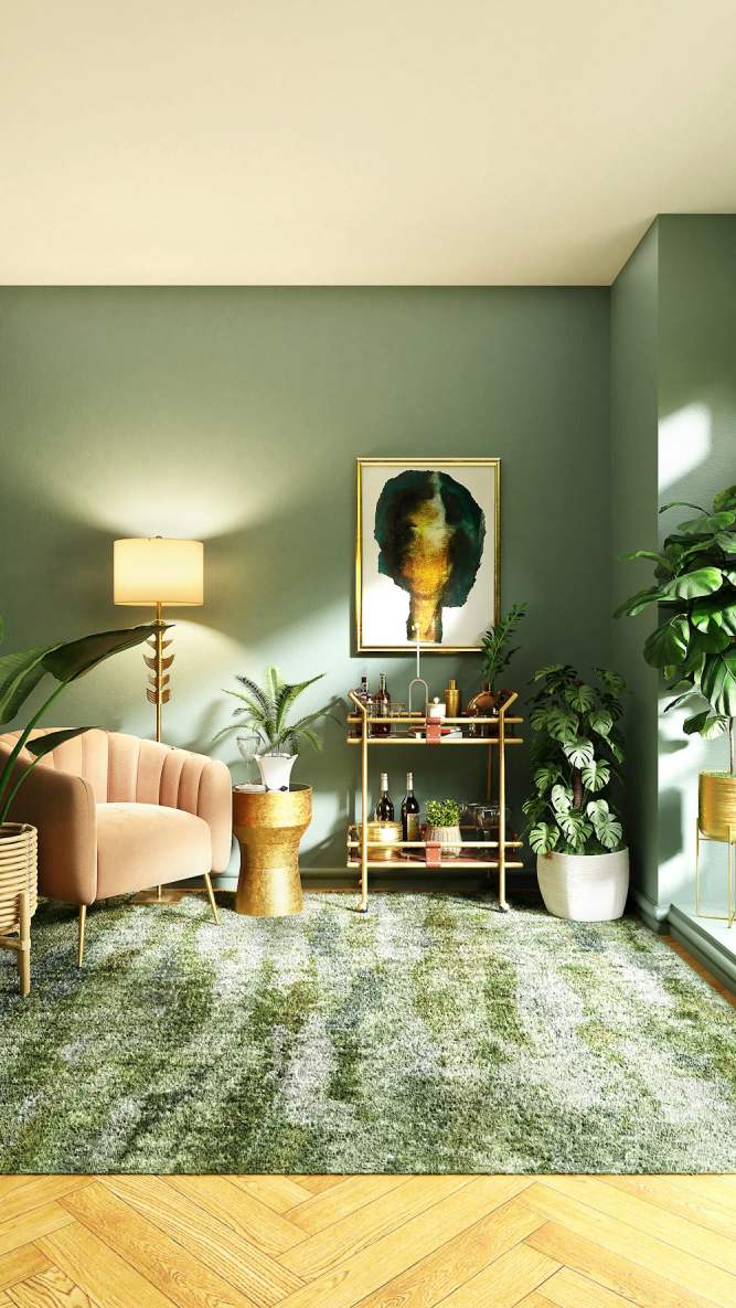 sala de estar com poltrona rosa decorada com plantas, tapete e parede verdes