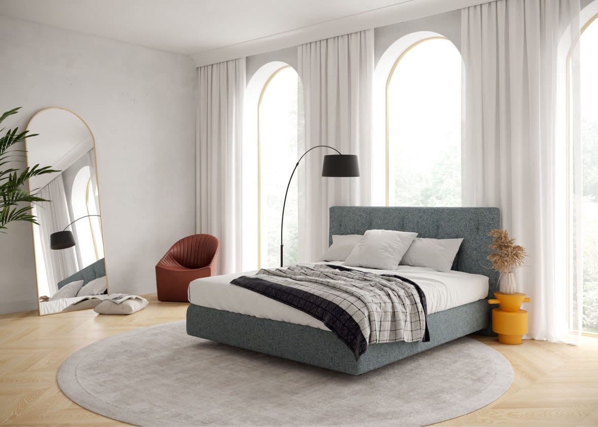 dormitorio moderno con cama de matrimonio azul tapizada