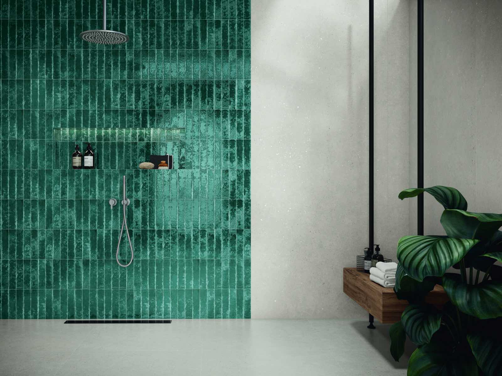 modern bathroom with green tiles in shower