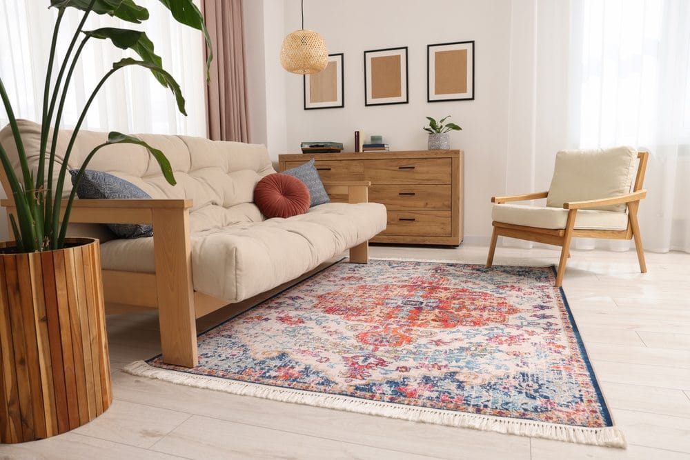 Modern furniture with vintage rug | New Africa/Shutterstock