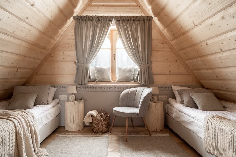 cozy bedroom with vaulted ceiling and two beds