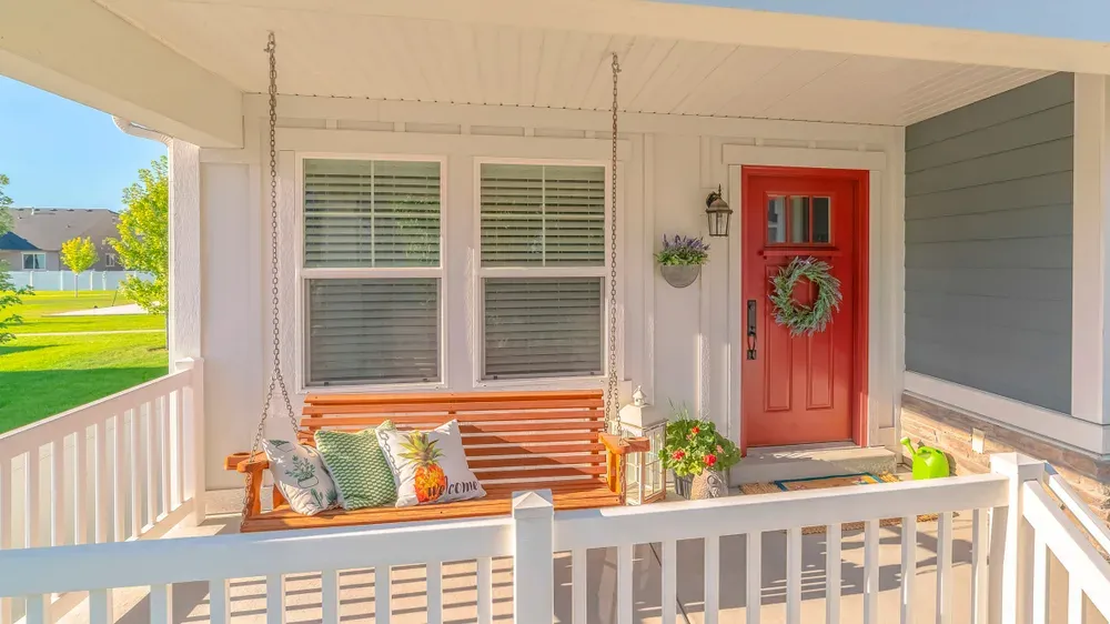 front porch with a swing