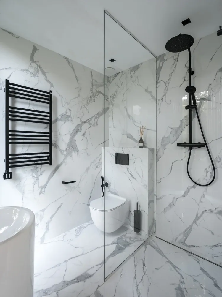 tiled bathroom with black finishes