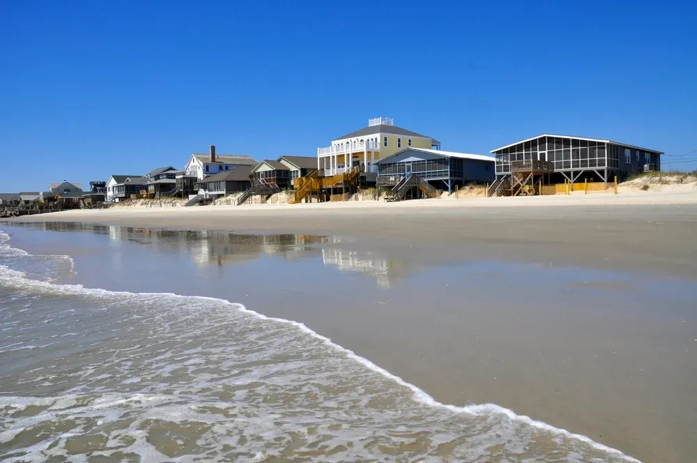 row of beach homes by the shore