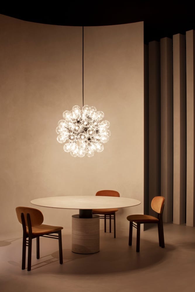 Dining table with sculptural lighting