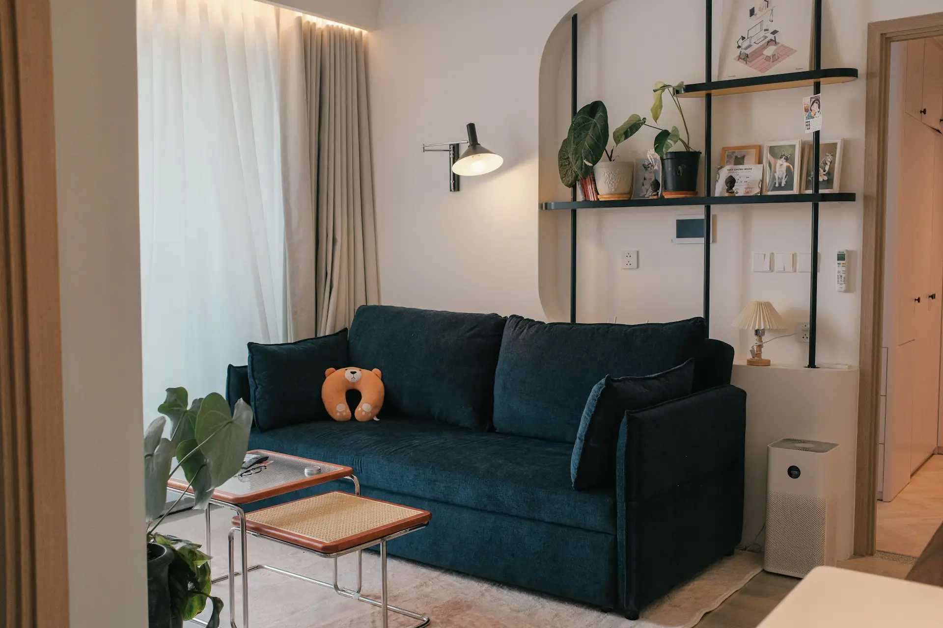 Best furniture for a small apartment, small living room with open shelving and nesting table