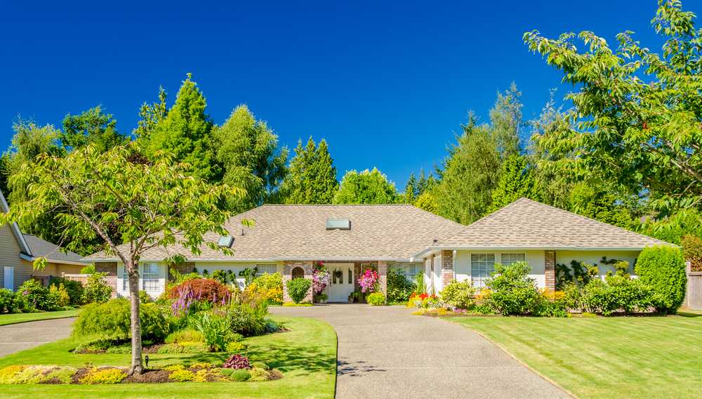 large one level home with a u-shaped driveway