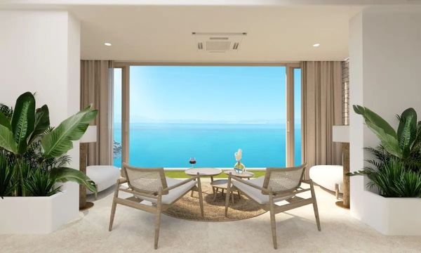 casa airbnb en Grecia con vistas al mar, sala de estar de diseño con sillas de madera