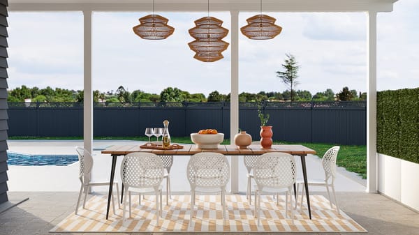 table de jardin avec 8 chaises et 3 lanternes brunes au-dessus
